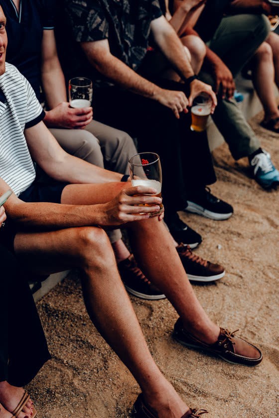 Guests with drinks in hand at an outdoor gathering